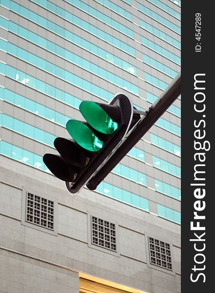 It is green traffic light and the building. It is green traffic light and the building.