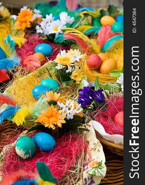 Easter eggs on the wooden plate