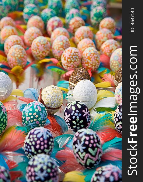 Easter eggs with colourful feathers