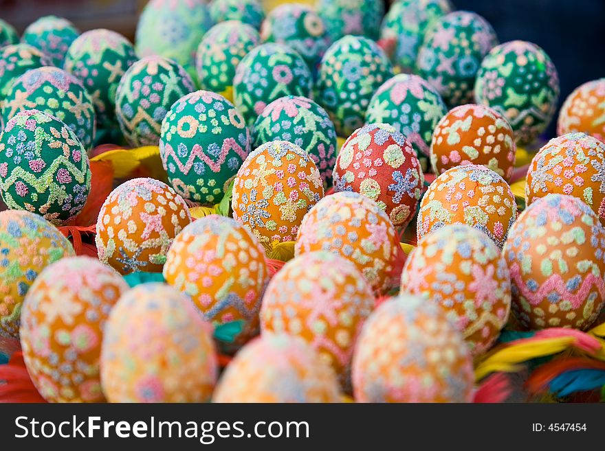 Easter eggs with colourful feathers