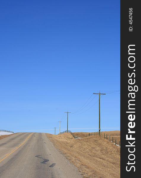 A prairie highway stretching of into the early spring