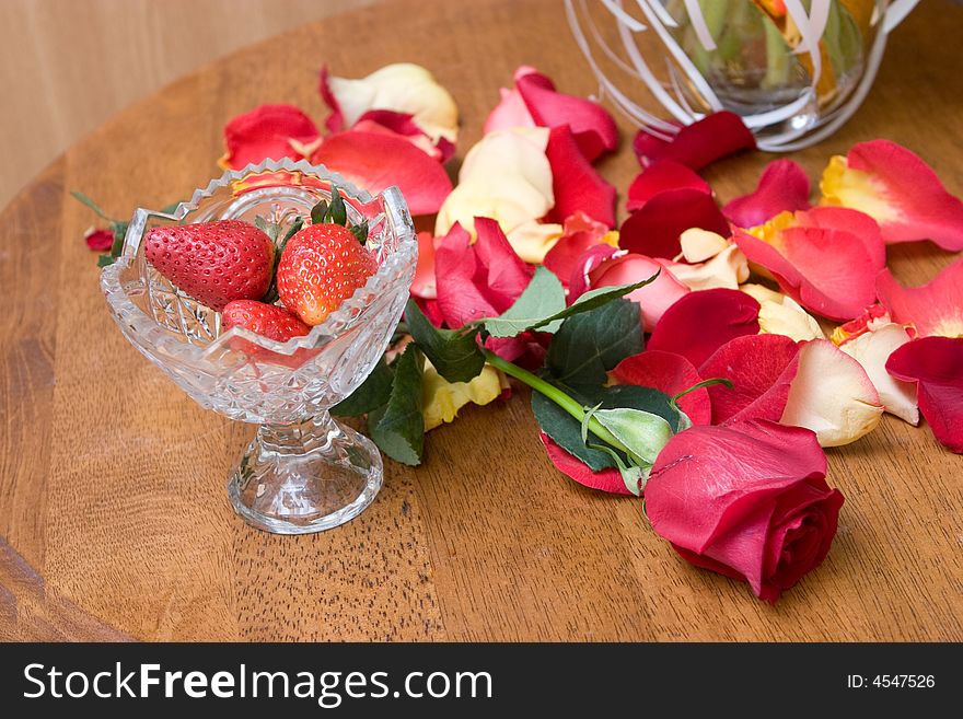 Red strawberry with petails of the roses