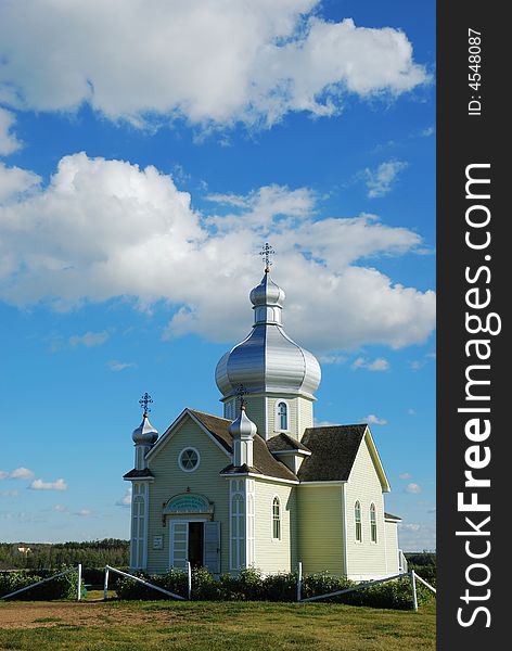 A white church under blue sky