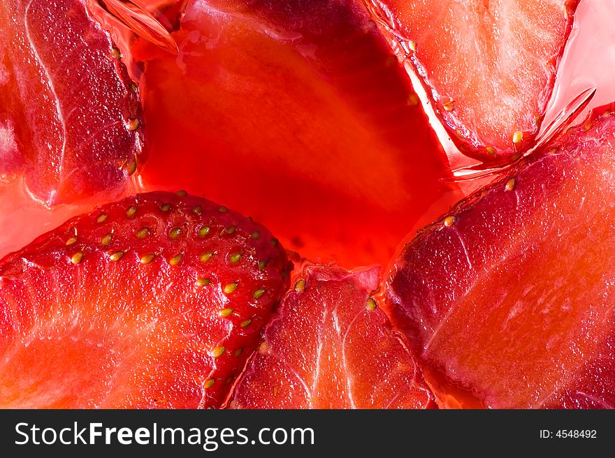 Close-up picture of jelly containing real juicy strawberries. Close-up picture of jelly containing real juicy strawberries