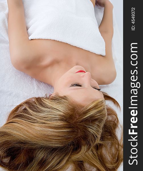 Attractive woman getting spa treatment on white