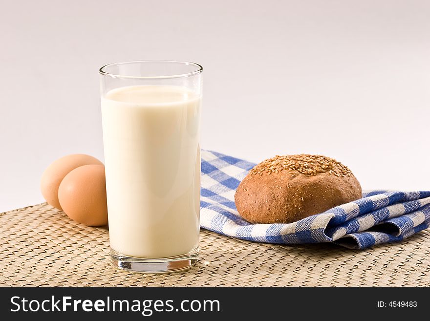 Light morning, milk with sweet bun and eggs
