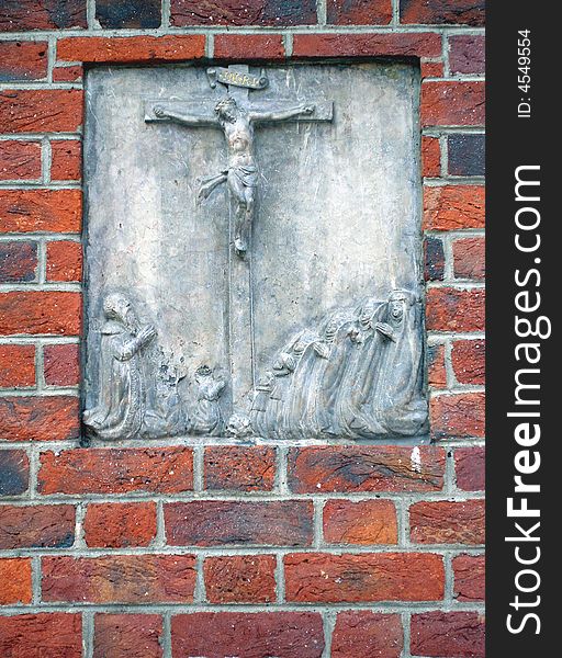 The crucified Christ bas-relief representing. The object is on the wall of the mariacki church.