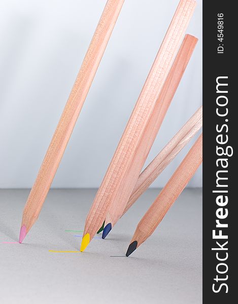 Multicoloured pencils on grey background