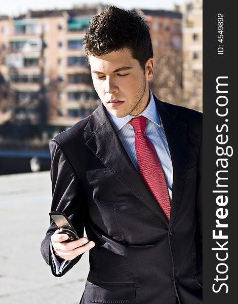 Businessman looking information at his phone. Businessman looking information at his phone