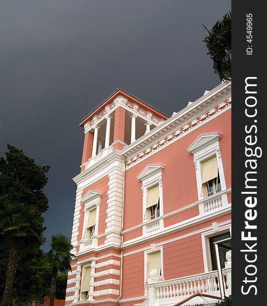 Famous touristic city of Rovinj - street building with dramatic sky. Famous touristic city of Rovinj - street building with dramatic sky