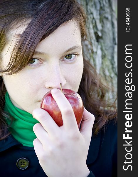 Green eyed young girl with apple. Green eyed young girl with apple