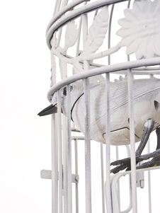 Mechanical Bird Looking Of Cage From Behind. Royalty Free Stock Photography Mechanical Bird Looking Of Cage From Behind. Royalty Free Stock Photography