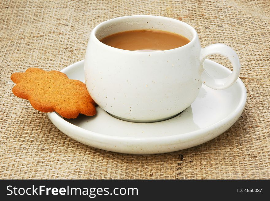 Cup of coffee and a biscuit. Cup of coffee and a biscuit