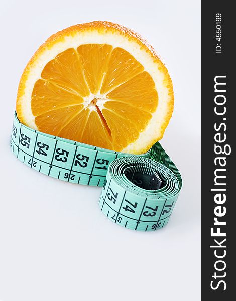 Fresh orange and green measuring tape. Fresh orange and green measuring tape