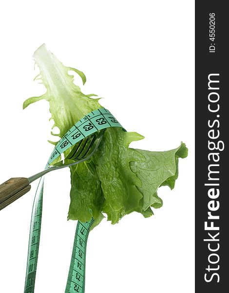 Leaf of fresh lettuce and measuring tape