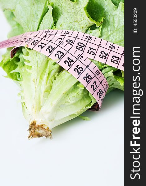 Fresh lettuce and measuring tape