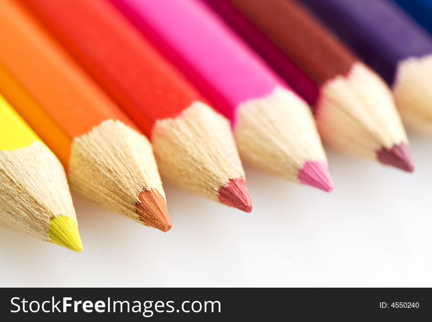 Pencils in different colors. focus on orange pencil. Pencils in different colors. focus on orange pencil.