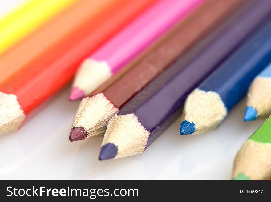 Pencils in different colors. Pencils placed uneven. Pencils in different colors. Pencils placed uneven.