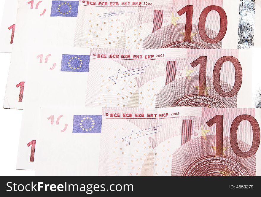 Three Ten Euro Notes Stacked On White Background