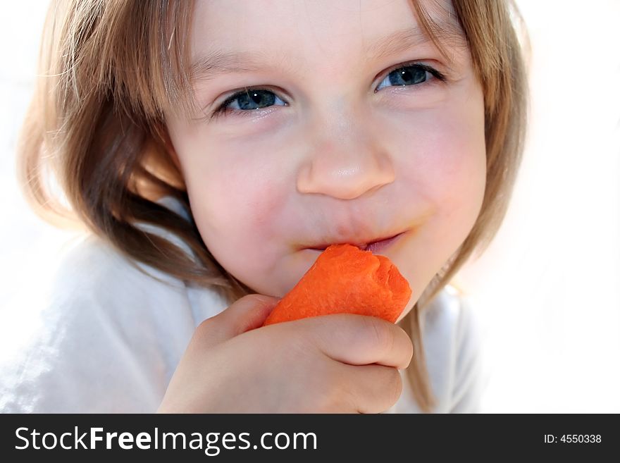 Happy Girl Eating Carrot