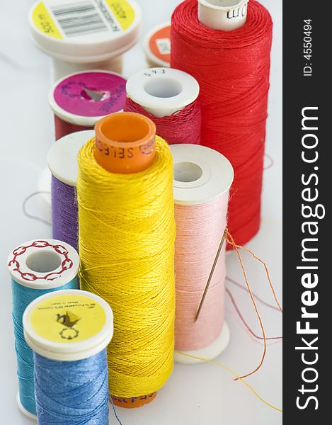 Close up of different colors of thread.