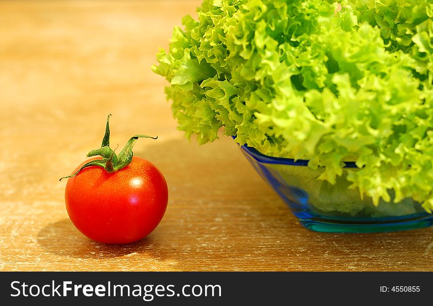 Fresh salad and a  tomato close-up shot