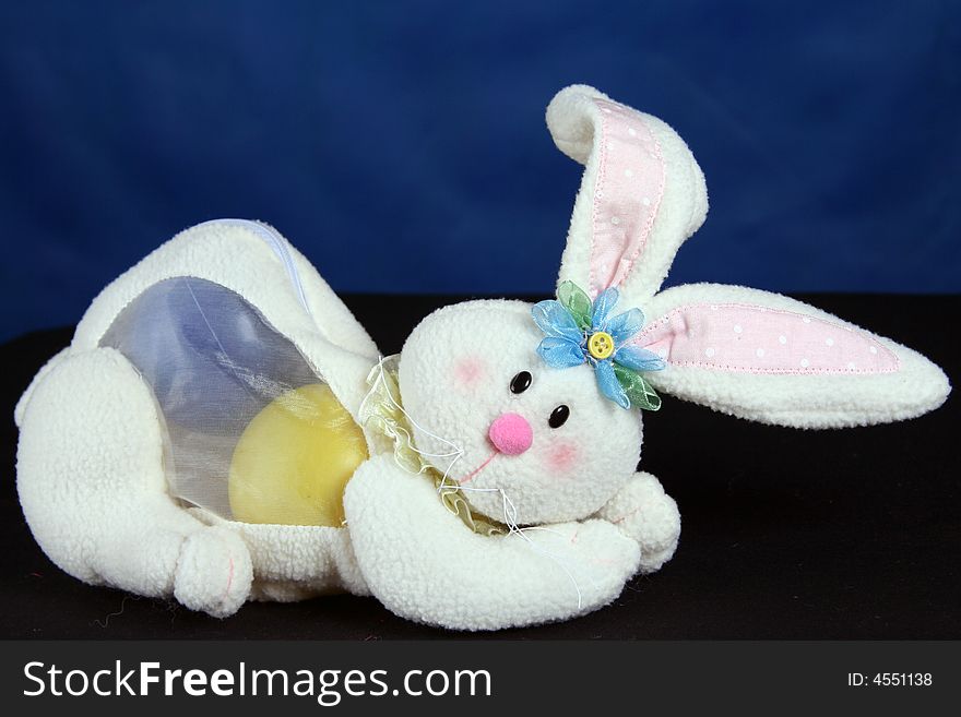 Rabbit with easter eggs over blue background. Rabbit with easter eggs over blue background