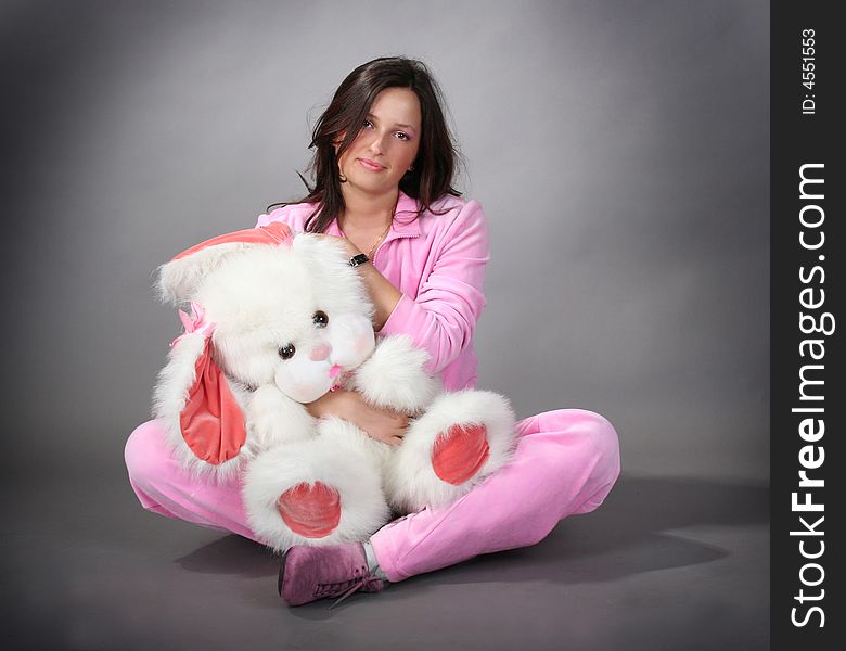 Young pretty girl with fluffy toy