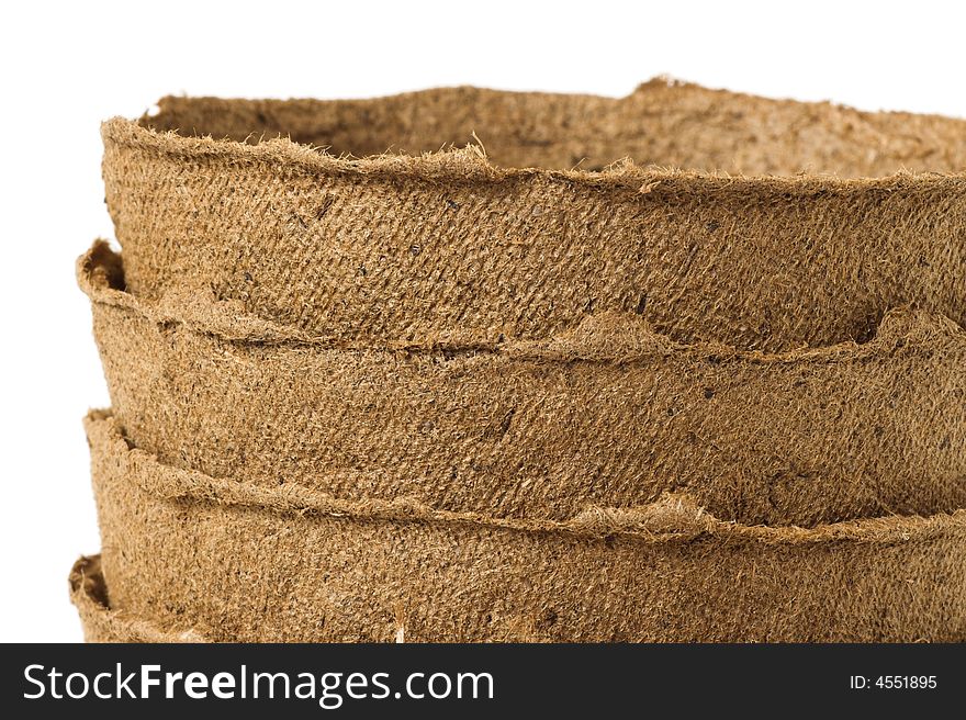 Detail of a stack of peat plant pots. Detail of a stack of peat plant pots.