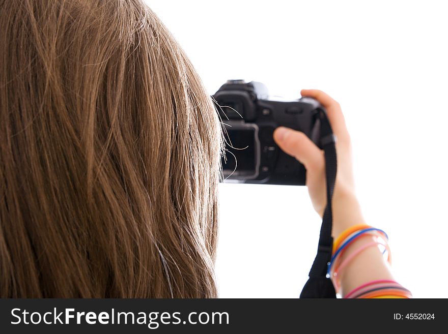 The young beautiful girl with the camera isolated on a white background