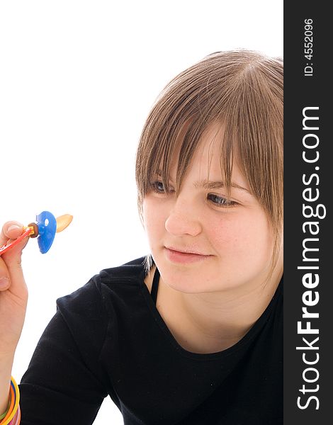 The young amusing girl with a dummy isolated on a white background