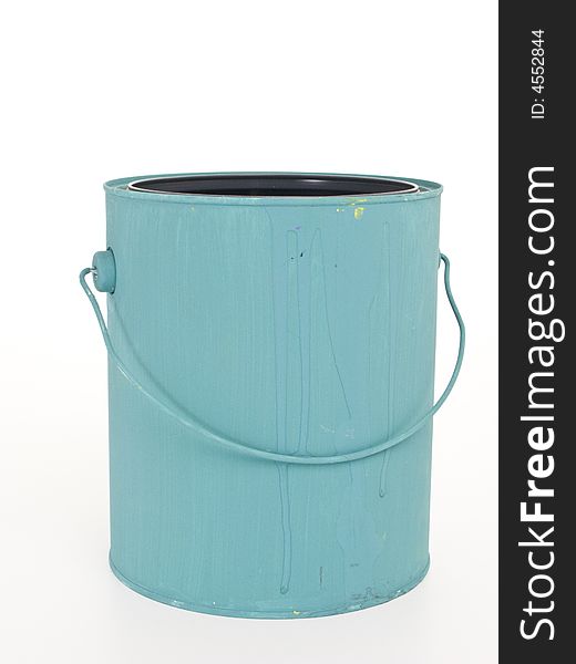A gallon paint can painted blue with it's lid off on a white background.  T. A gallon paint can painted blue with it's lid off on a white background.  T