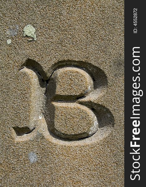 Letter B, part of entire alphabet, found in a country churchyard