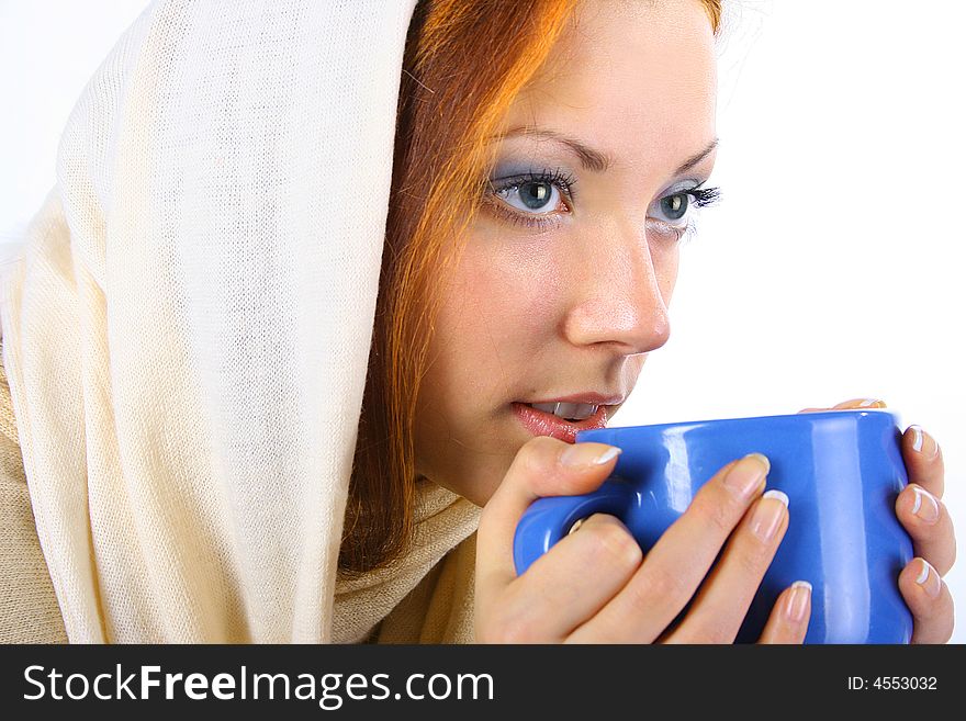 Beautiful girl is drinking tea