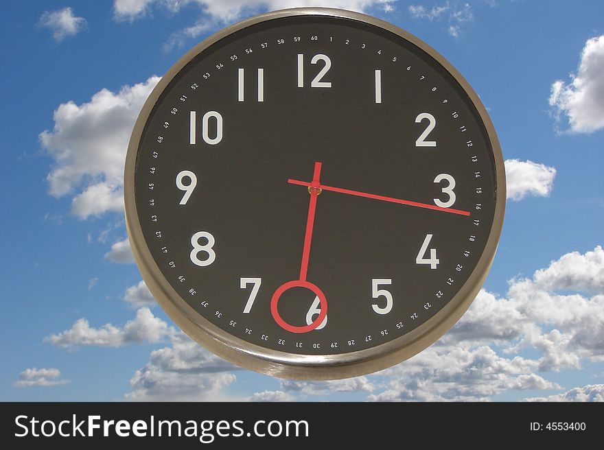 Big clock with a blue sky as a background