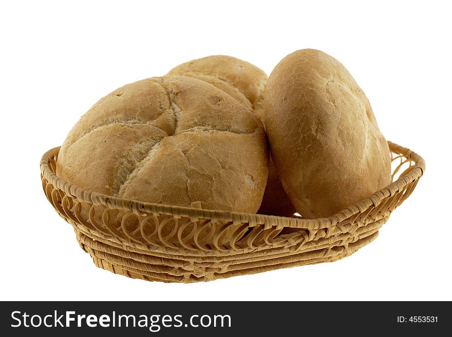 A basket of baked rolls, isolated. A basket of baked rolls, isolated
