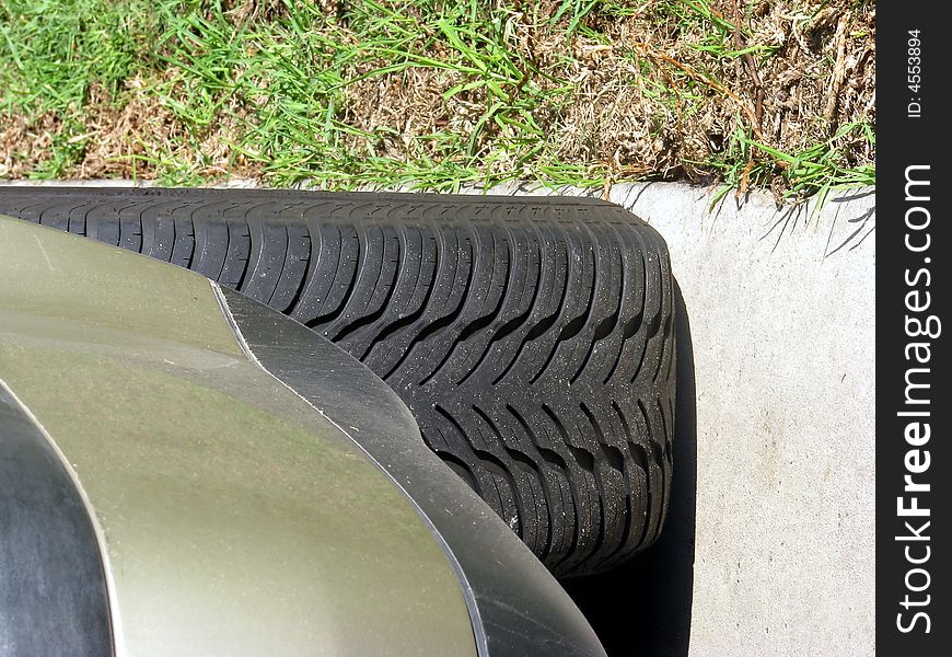 A car tyre clearly showing the tread
