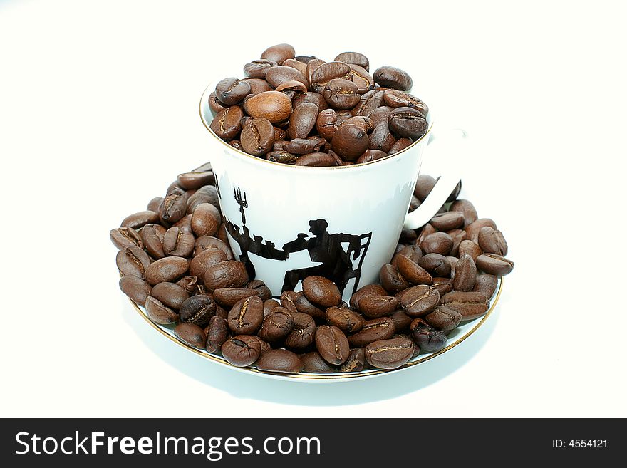 White coffee cup with coffee beans