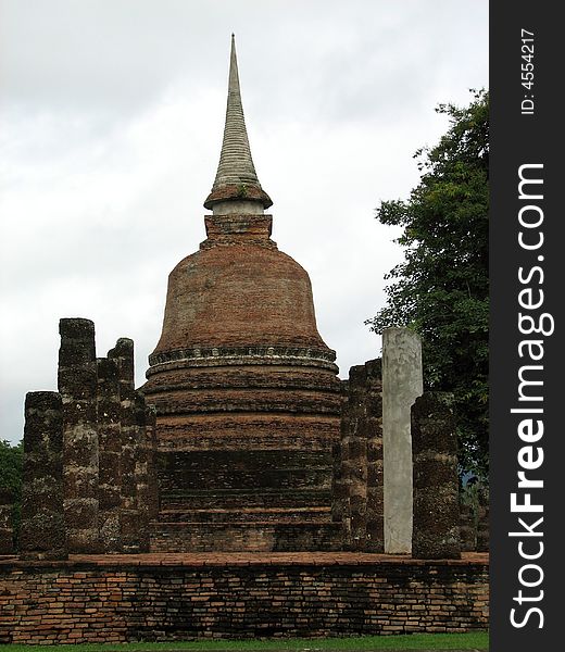 A single brick stupa in Sukhothai National Park.  Sukhothai, Thailand.