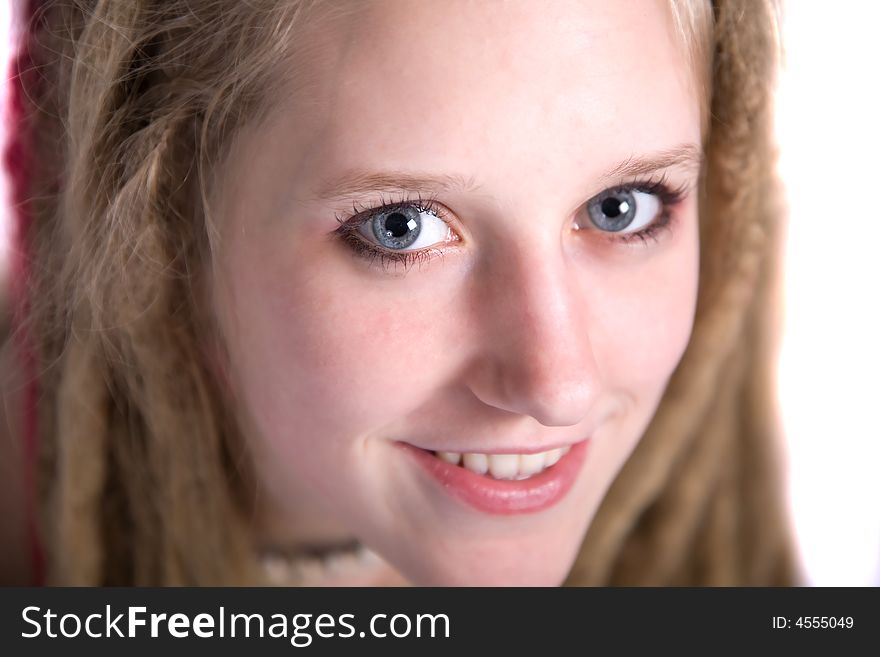 A pretty blond girl with dreads smiling at the camera. A pretty blond girl with dreads smiling at the camera