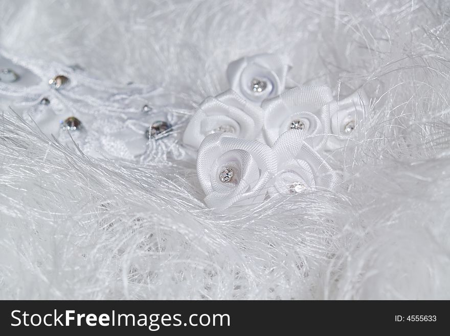 Group of wedding details on white fur background