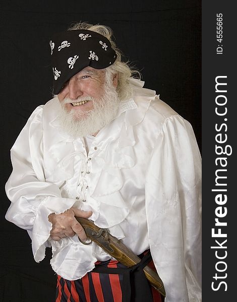 An old man dressed as a pirate. An old man dressed as a pirate