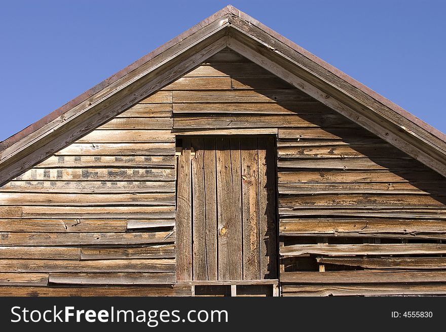 Old rustic barn in New Mexico agaisnt a blue sky