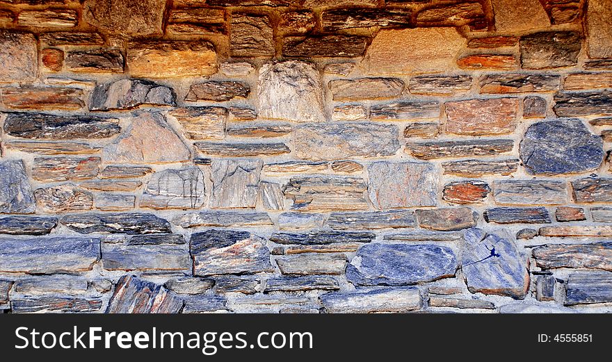 Red and  blue stone wall