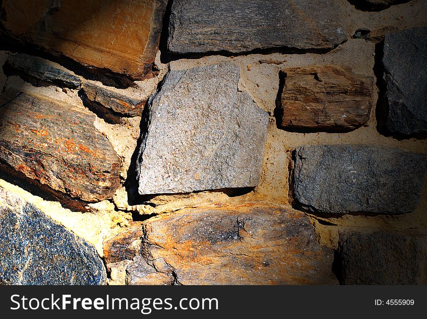 Stone wall with spotlight