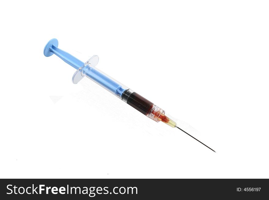 Red liquid filled blue syringe with needle