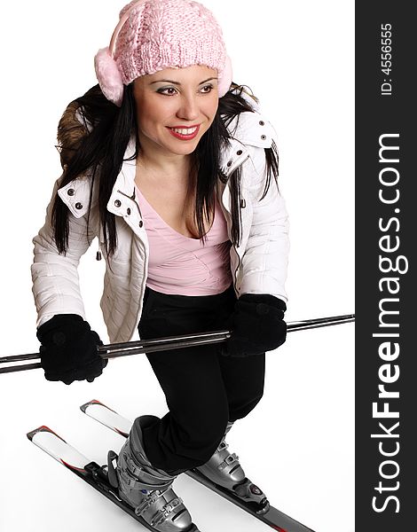 Active female in winter ski  clothing having fun on some skis. Active female in winter ski  clothing having fun on some skis