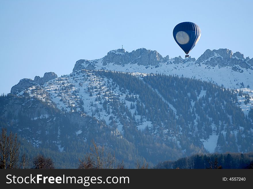 Big blue Baloon on the Alps mountains background. Big blue Baloon on the Alps mountains background