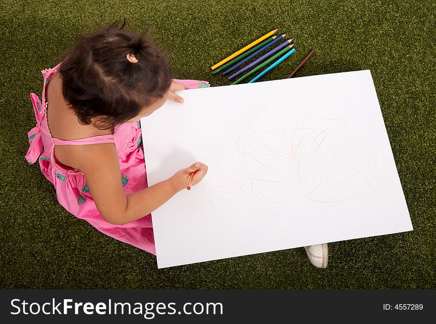 Little young girl drawing on white board