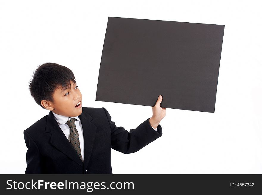 Young businessman in black suit holding placard